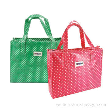 Coated shopping bag with logo patch